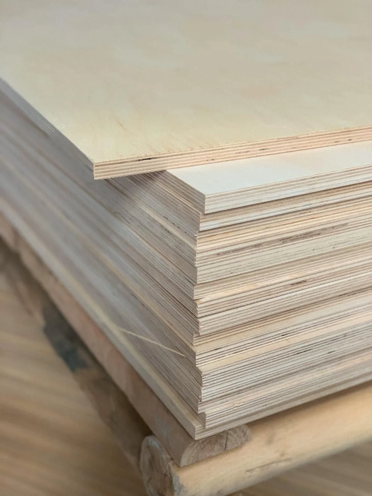 Stacked birch plywood panels showing layered edges